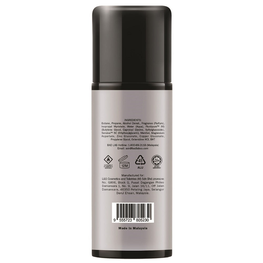 The back of a cylindrical aerosol spray bottle with a black cap and a metallic silver body, showing printed ingredient and barcode text on a white background.