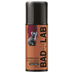 A 135ml bottle of Bad Lab Slumber Buck Woody Spice dual action deodorant spray, featuring a black cap and a brown label with a koala graphic.