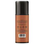 Back view of a cylindrical cosmetic bottle with a black cap and a warm brown label, showing product text, icons, a barcode, and 'Made in Malaysia' on a white background.