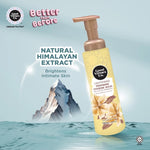 Good Menses Co. Natural Himalayan Extract Lightening Feminine Hygiene Wash in a 150ml pump bottle, shown floating over a stylized graphic of a mountain and water with promotional text.
